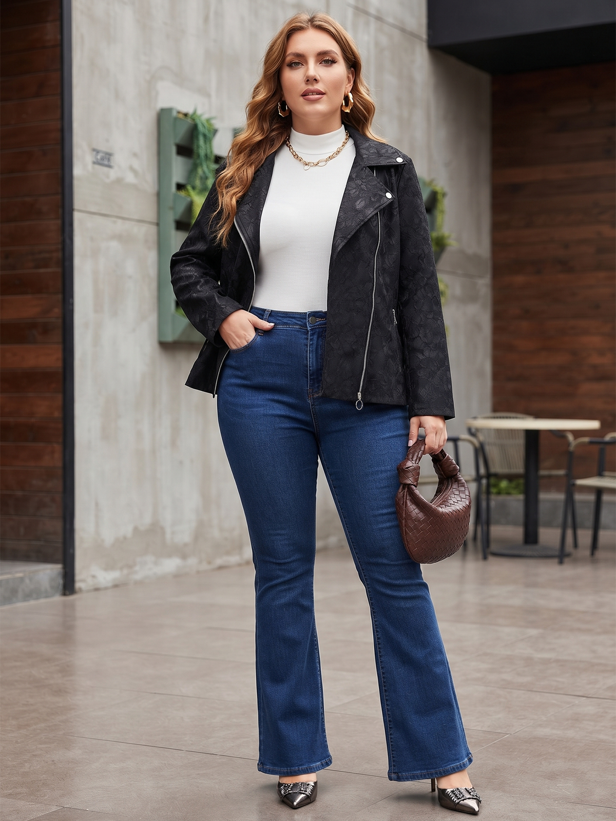 Lace-knit jacket with zip pockets in black, styled with jeans outdoors.