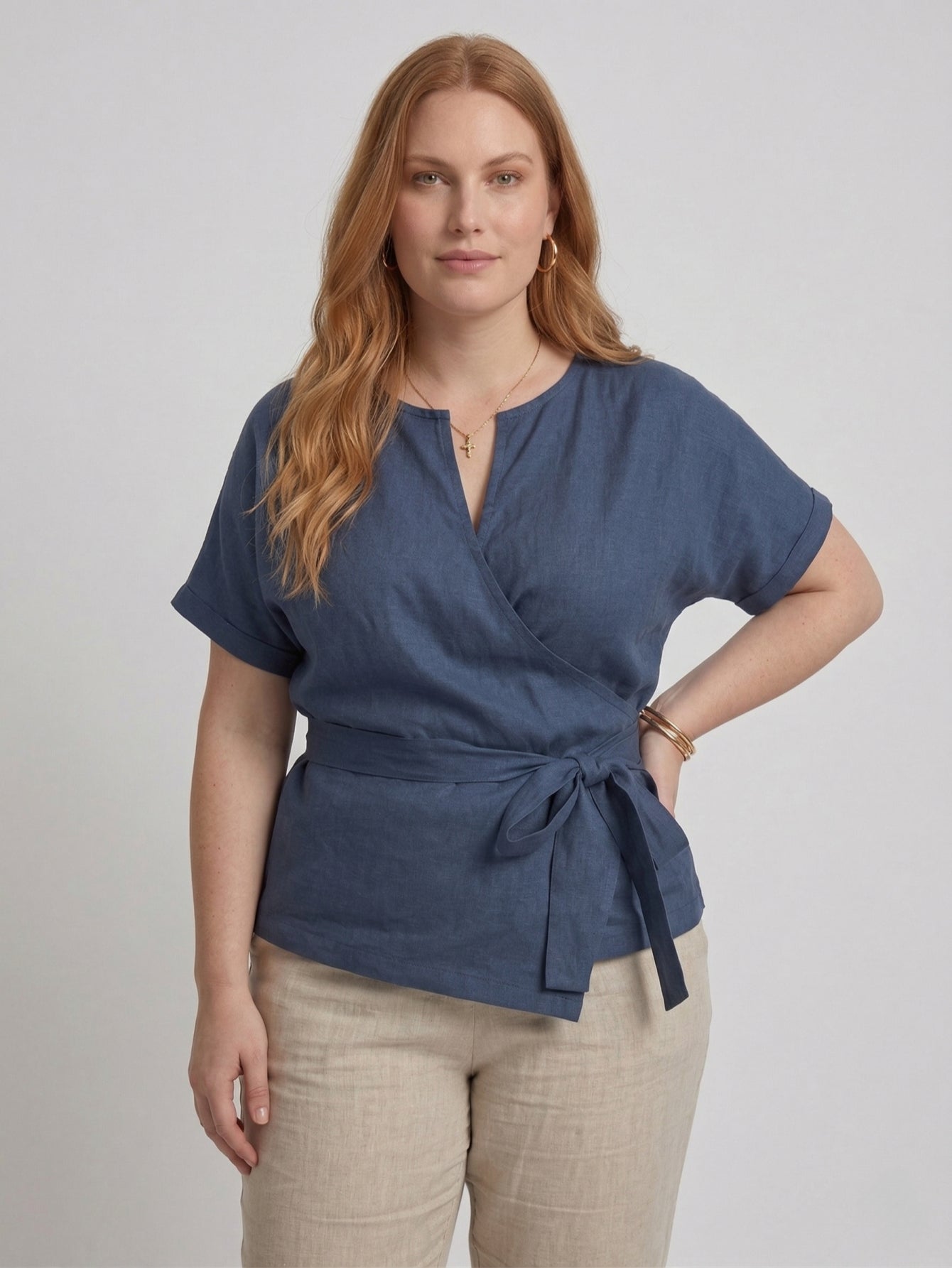 Navy linen blouse with short sleeves and tie belt, front view.