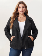 Lace-knit jacket with zip pockets in black, front view with hands in the pockets.
