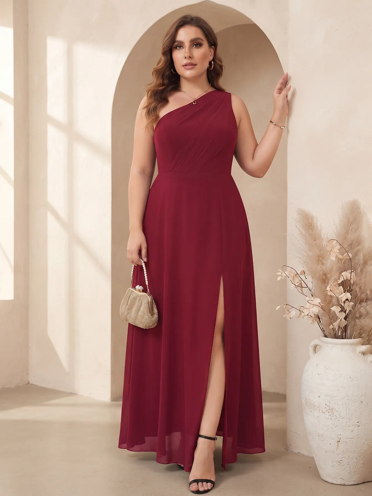 One-shoulder chiffon maxi dress in burgundy, outfit shown indoors.